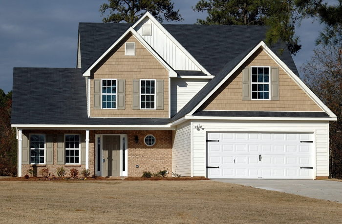 a home with a white garage door