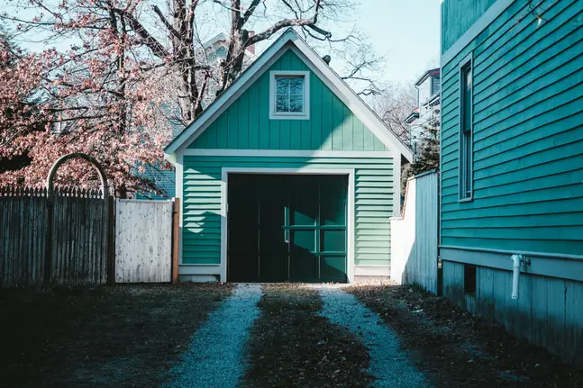 A green, closed garage door